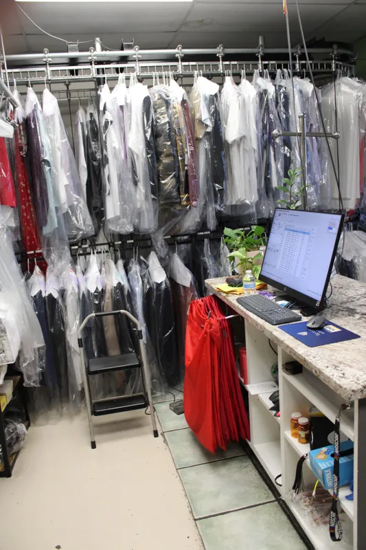 MC Cleaners front counter with garments ready for pickup